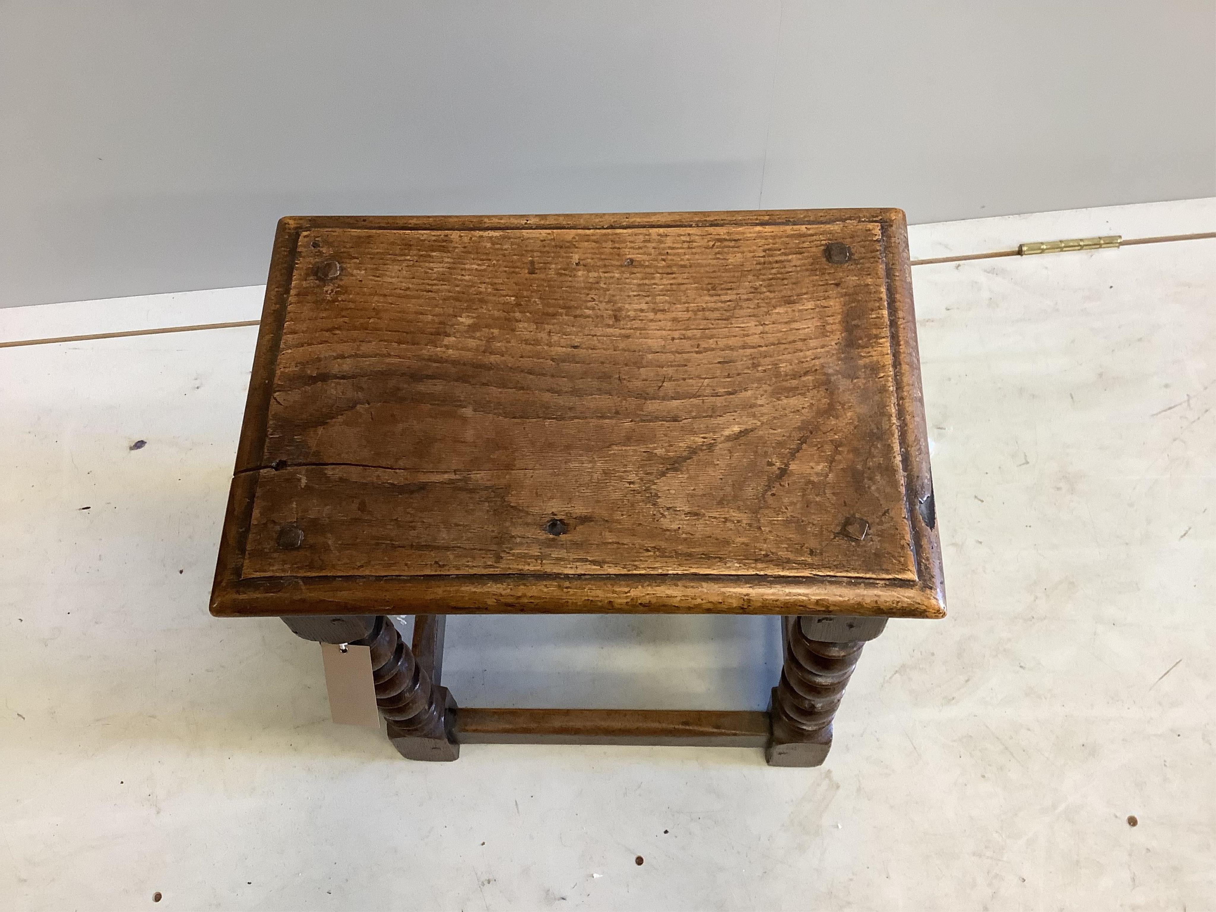 An 18th century style rectangular oak joint stool, width 42cm, depth 27cm, height 46cm. Condition - poor to fair